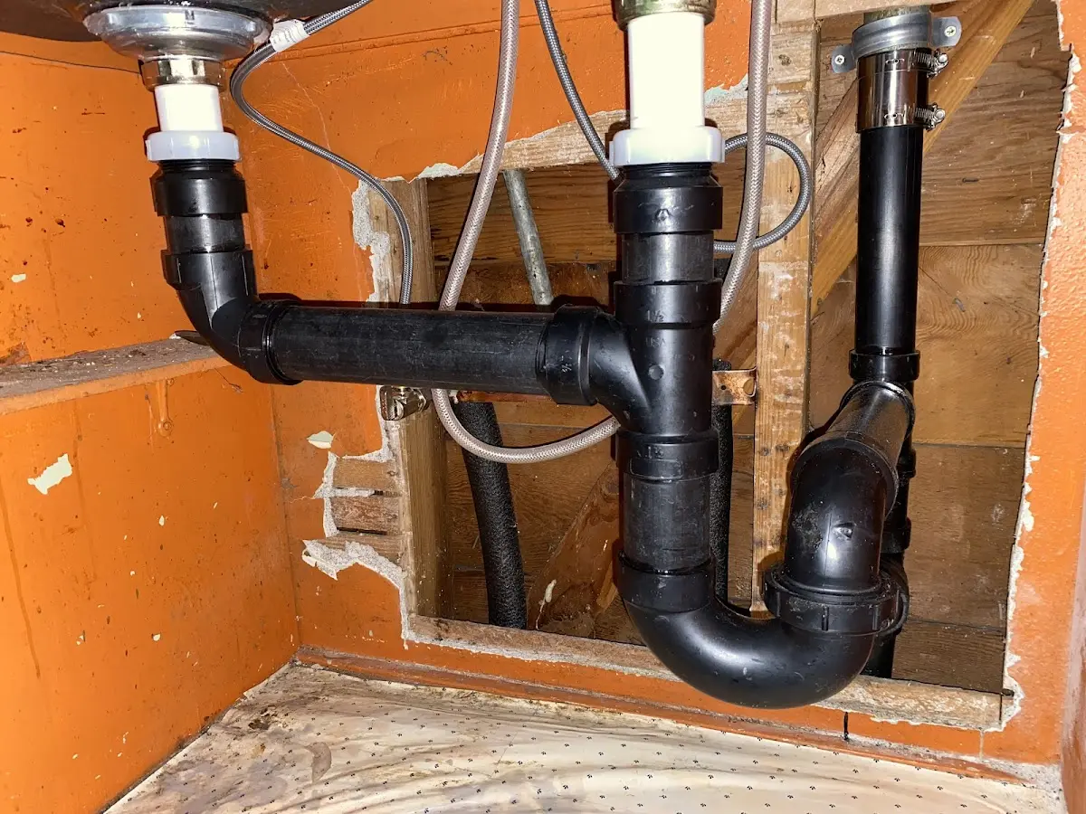 Professional Garbage Disposal Repair equipment and tools on the job in Darien